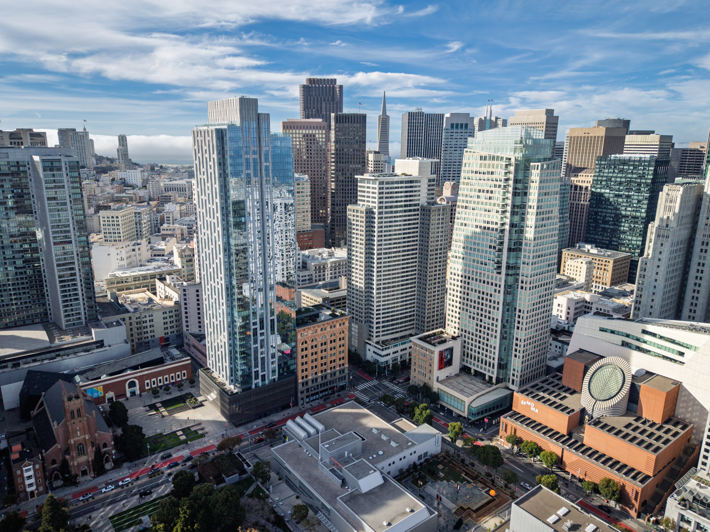 Aerial view of 706 Mission beside SFMOMA and the downtown San Francisco skyline